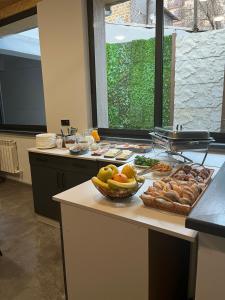 a kitchen with a buffet of food on a counter at New Casa Boutique Hotel in Yerevan
