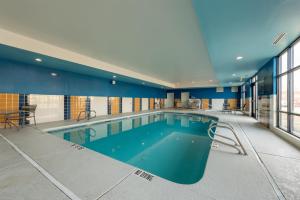 a large swimming pool in a building at Hampton Inn La Junta in La Junta
