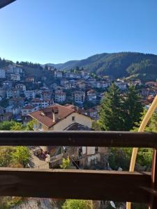 a view of a city from a balcony at Планинска ЗВЕЗДА in Chepelare
