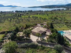 an aerial view of a mansion with a lake at Villa with private pool and stunning sea view in Galaxidi