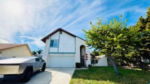 a house with a car parked in front of it at Joshie home in Rancho Cucamonga