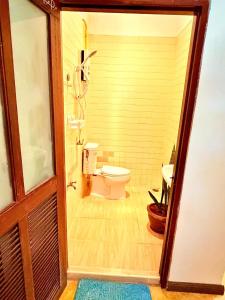 a bathroom with a toilet and a sink at Amazing beach apartment Phuket in Phuket