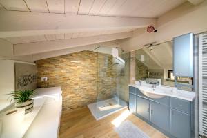 a bathroom with a sink and a mirror at Casa Vacanza Nonna Pia I & III in "Piazza Basilica" in Tirano +40 photos