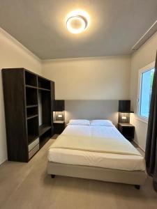 a bedroom with a large bed in a room at Anastasi Residence in Cervia +2 photos