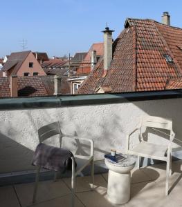 two chairs and a table on a balcony at Rex Palast in Memmingen