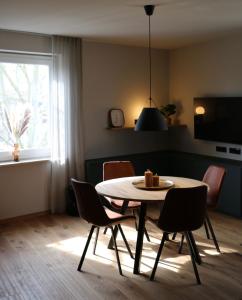 a dining room with a table and chairs at Rex Palast in Memmingen +16 photos
