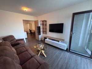 a living room with a couch and a flat screen tv at Ela in Žusterna