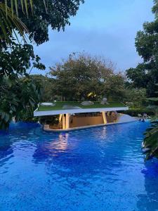a resort with a large pool of blue water at Seaside Living Studio Unit in Maribago +8 photos