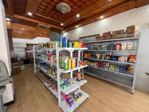 a grocery store aisle with shelves filled with food at Center Orient Hotel in Danang