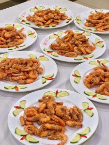a group of plates of food on a table at Center Orient Hotel in Danang +39 photos