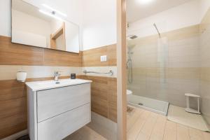 a bathroom with a sink and a mirror and a tub at Central Terrace, Pula in Pula +23 photos