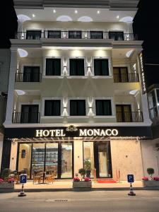 a hotel morocco with a sign in front of it at Hotel Monaco in Kamëz