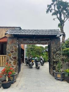 a group of motorcycles parked outside of a building at Flora Garden Homestay in Xuân Sơn