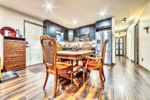 a kitchen with a dining room table and chairs at Neocolonial Quarters in Vancouver