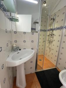 a bathroom with a sink and a shower at Campos Essencia in Arganil +37 photos