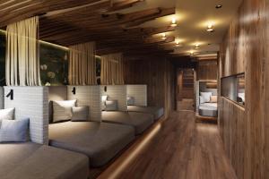 a bedroom with two beds in a room at Hotel Central - das kleine Boutique Hotel am Achensee in Pertisau