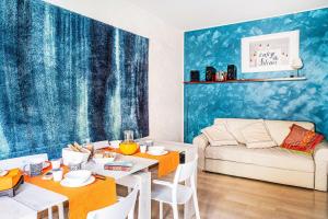 a living room with a table and a couch at ApartmentsPadova in Padova