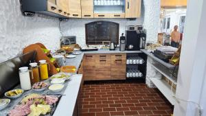 a kitchen with a counter with food on it at pfefferHÄUSL in Regen