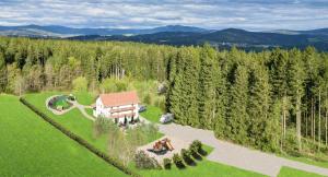 an aerial view of a house in the middle of a forest at pfefferHÄUSL in Regen