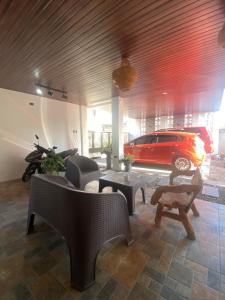 a living room with a car parked in a garage at Balay Buenavista in Magdalena