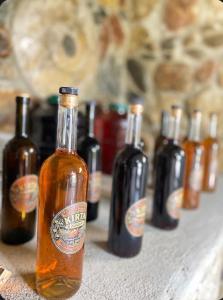 a group of bottles of beer sitting on a table at Kirta in Gordi +36 photos