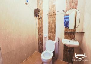 a bathroom with a toilet and a sink at Casa-Miranda Homestay in Daet +42 photos