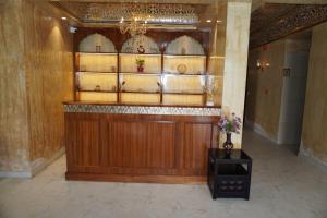 a room with a large wooden bar in a building at Neendar Heritage Resort in Jaipur