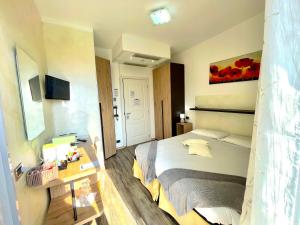 Llit o llits en una habitació de Hotel Lauro 47 fotos més
