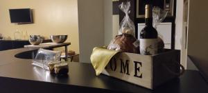 a bottle of wine in a box on a counter at Pico Blue Ocean - Sea House in São Roque do Pico +16 photos