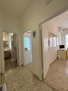 an empty room with a door and a bathroom at Alloggio Primavera Matilde in Terni +19 photos