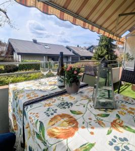a table with a table cloth with wine glasses at Fewo Marek in Gaienhofen