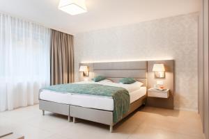 Ein Bett oder Betten in einem Zimmer der Unterkunft City Stay Furnished Apartments - Lindenstrasse