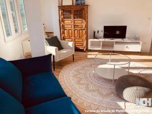 a living room with a couch and a table at Fuentes 8 in Soria