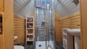a bathroom with a shower and a sink at Oak Hill Escape in Welshpool +17 photos