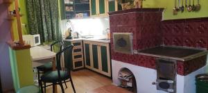 a kitchen with a play kitchen with a play stove at Zlatý Žabák in Suchý +6 photos