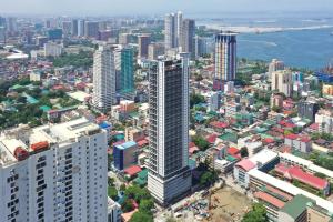 an aerial view of a city with tall buildings at lyf Malate Manila managed by The Ascott Limited in Manila