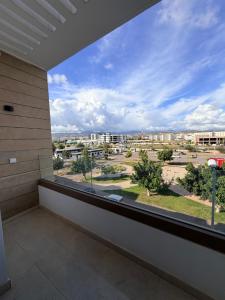 a balcony with a view of a city at Stay with US in Agadir