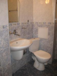 a bathroom with a toilet and a sink at Hotel Nakra in Radnevo +22 photos