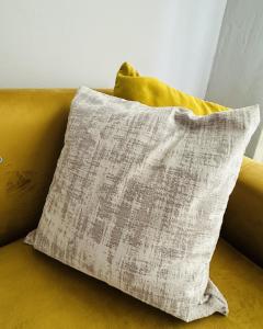 a pillow sitting on top of a couch at DeltaGateway selfcatering in Maun Airport