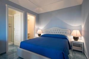Postel nebo postele na pokoji v ubytování Collina Degli Ulivi B&B