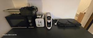 a counter with a wii controllers and a printer at Cazino4Love in Constanţa