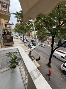 a view of a city street from a balcony at Abla's sweet home in Tirana