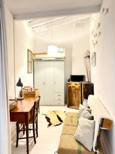 a room with a table and a bed and a desk at Can PONÇ PARRA in Santanyi