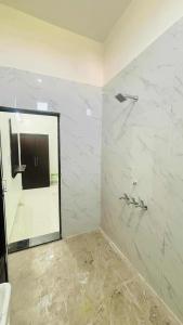 a bathroom with a mirror and a shower at Hotal Shivaay inn in Barāgaon