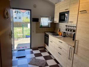 a kitchen with a checkered floor at Ferienhaus Dresden in Dresden +14 photos