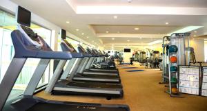 a gym with a row of treadmills and machines at The Grand Kandyan in Kandy +70 photos