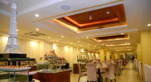 a restaurant with a eiffel tower on the ceiling at The Grand Kandyan in Kandy