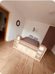 a bedroom with a bed in the corner of a room at AS Apartment Free Parking and Peaceful Nature near Ljubljana in Škofljica