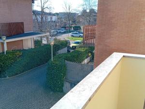 a balcony of a building with a parking lot at Casa Rotary in Lugo