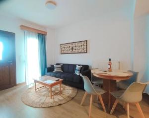 a living room with a couch and a table at Metsovo apartment in Metsovo